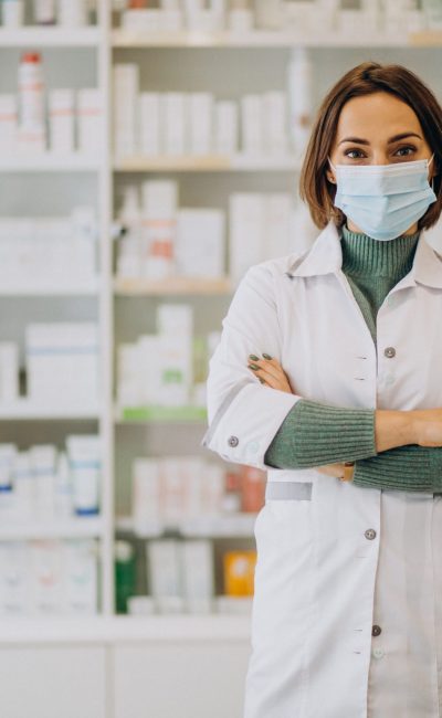 Young woman pharmacist at pharmacy